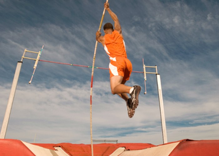 A pole vaulter clearing the bar